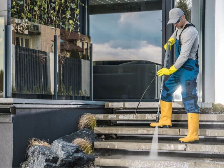 power washing concrete steps of a house in Panama City