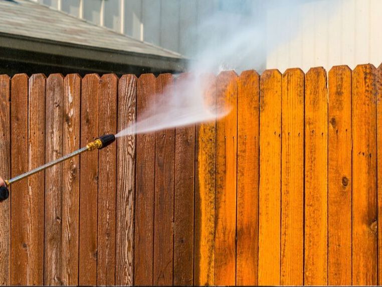 pressure washing a wood privacy fence in Panama City Florida